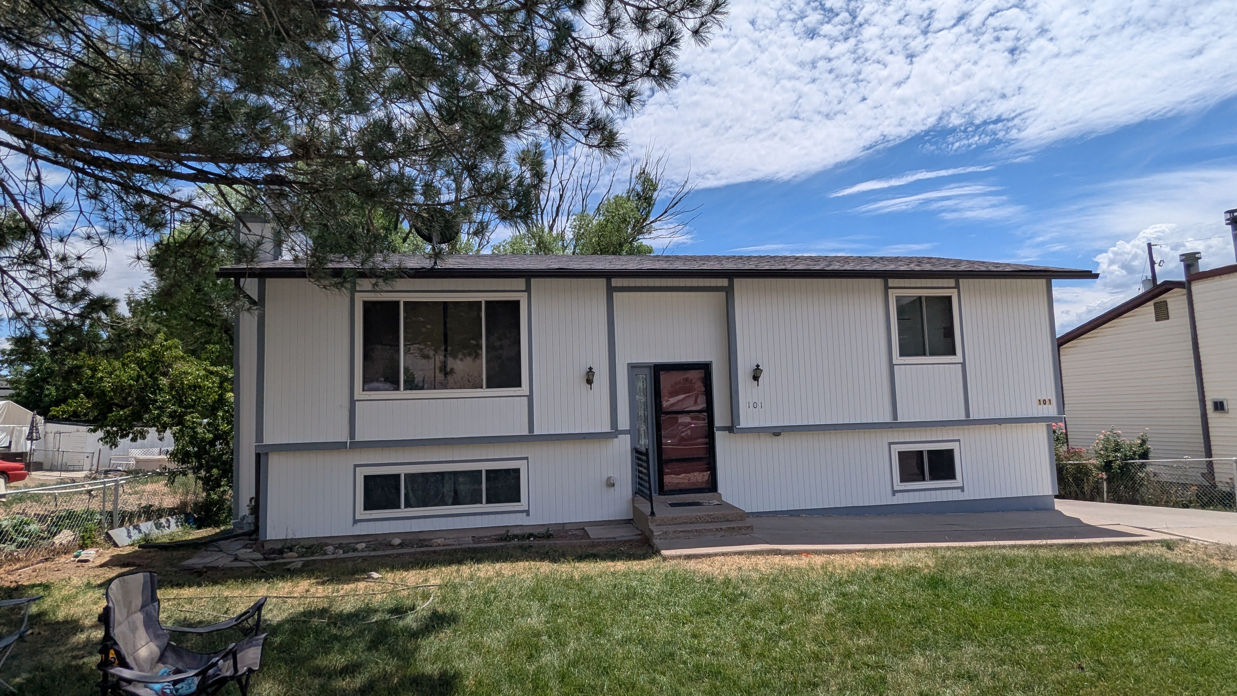 Finished white exterior repaint with red trim